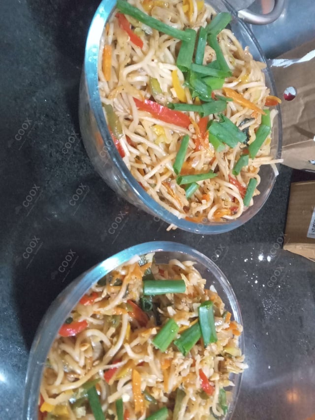 Delicious Chicken Chilli Garlic Noodles prepared by COOX