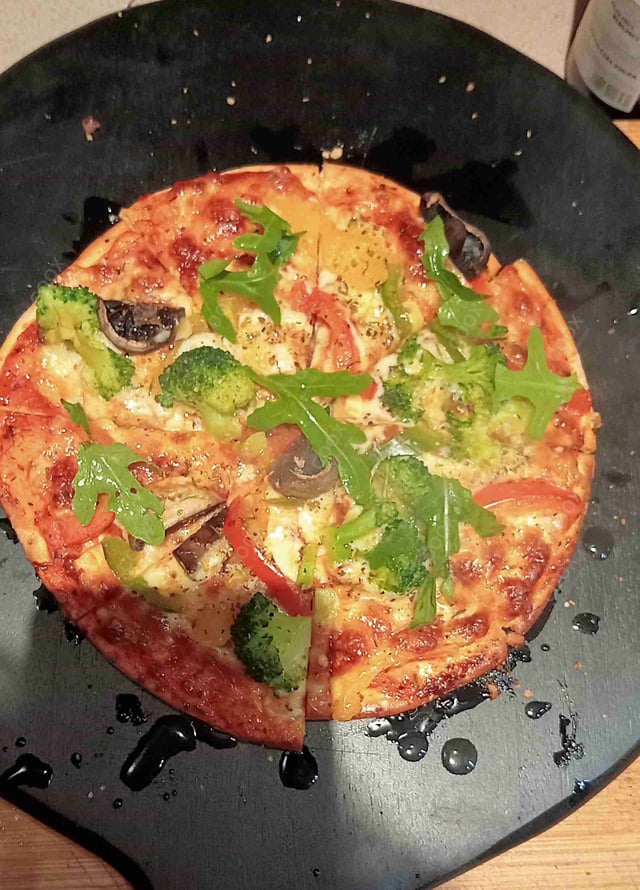 Delicious Veg Pizza prepared by COOX