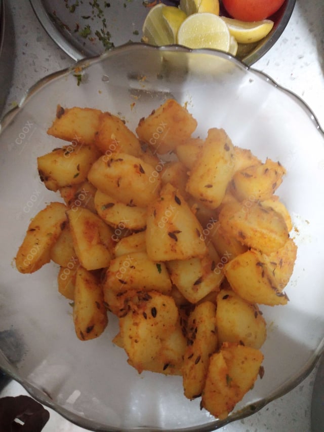 Delicious Jeera Aloo prepared by COOX