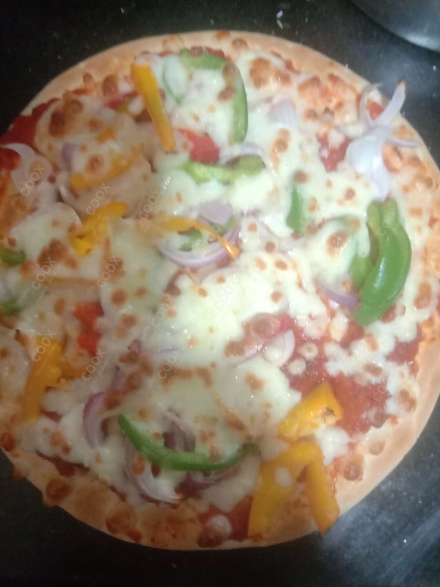 Delicious Veg Pizza prepared by COOX