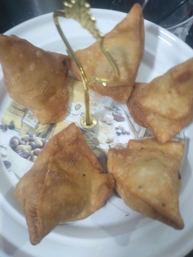 Delicious Mini Samosas prepared by COOX