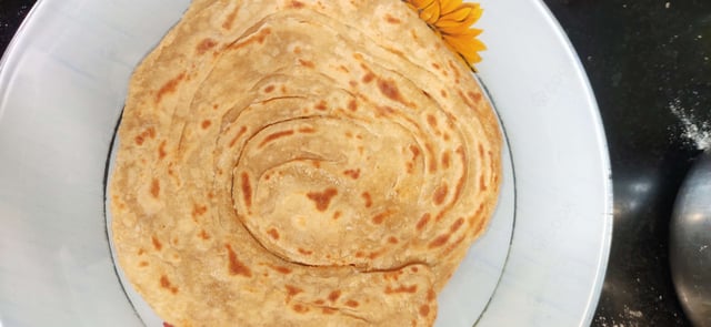 Delicious Lachha Parathas prepared by COOX