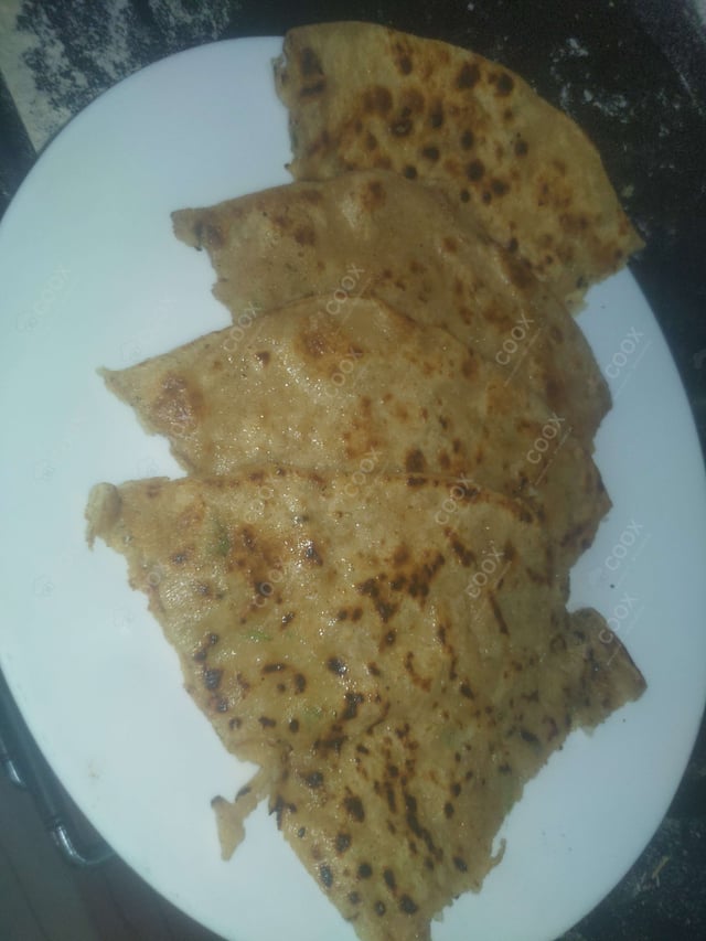 Delicious Stuffed Parathas prepared by COOX