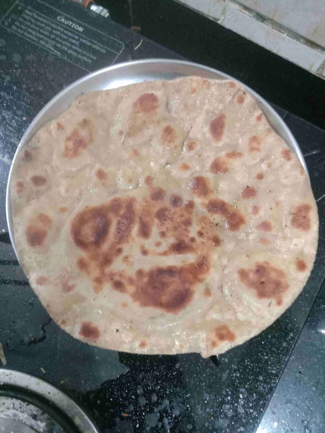 Delicious Lachha Parathas prepared by COOX