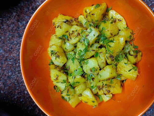 Delicious Jeera Aloo prepared by COOX