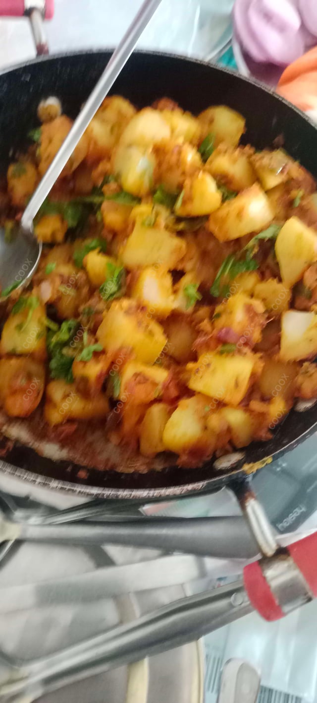 Delicious Jeera Aloo prepared by COOX