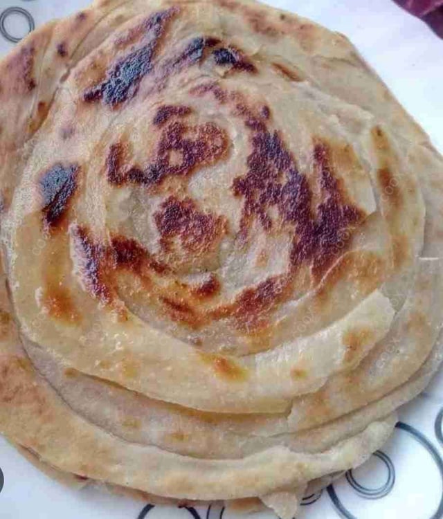 Delicious Lachha Parathas prepared by COOX