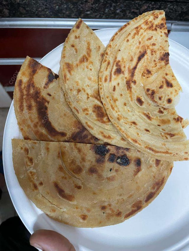 Delicious Lachha Parathas prepared by COOX