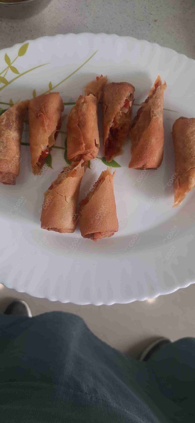 Delicious Veg Spring Rolls prepared by COOX