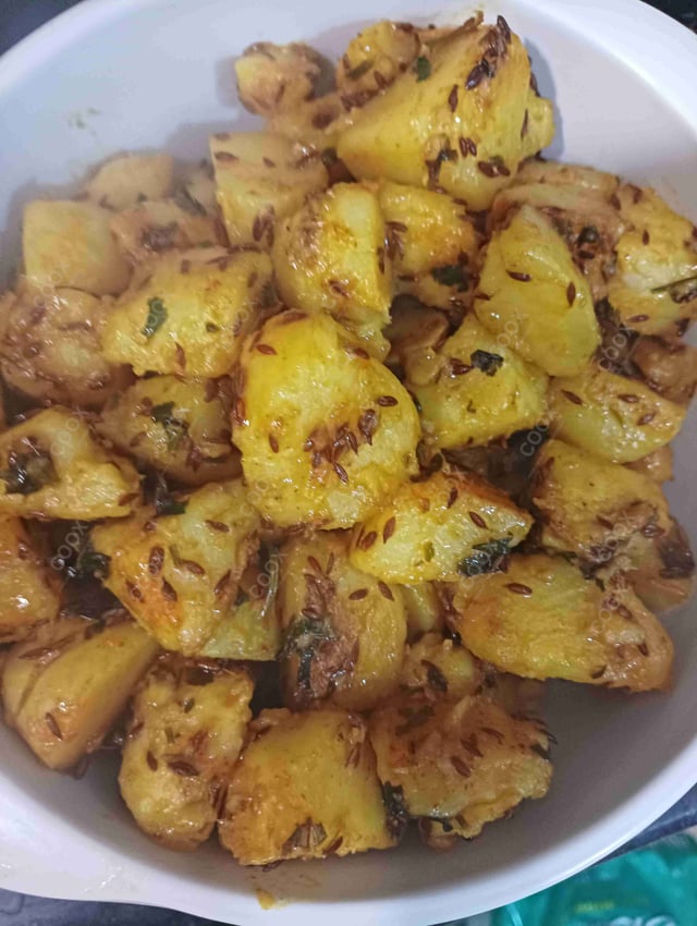 Delicious Jeera Aloo prepared by COOX