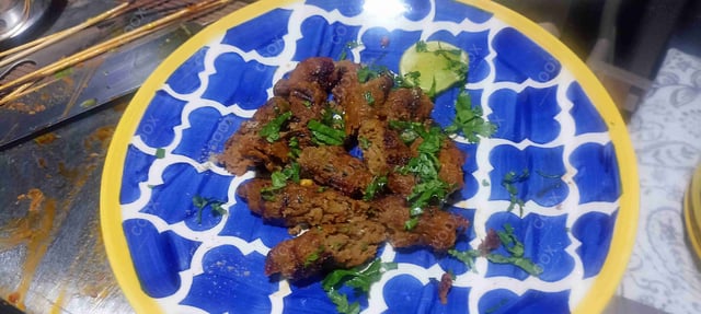 Delicious Mutton Seekh Kebab prepared by COOX