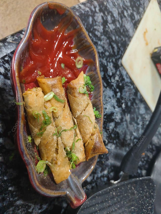 Delicious Veg Spring Rolls prepared by COOX