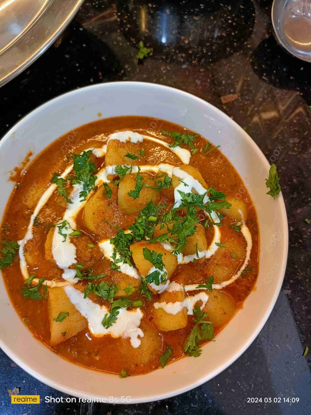 Delicious Dum Aloo prepared by COOX