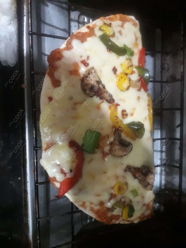 Delicious Veg Pizza prepared by COOX