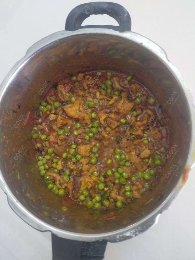 Delicious Gobhi Matar prepared by COOX