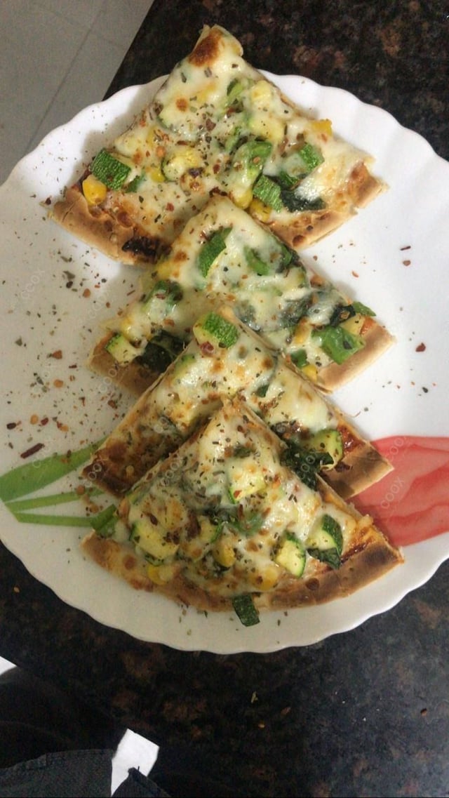 Delicious Veg Pizza prepared by COOX