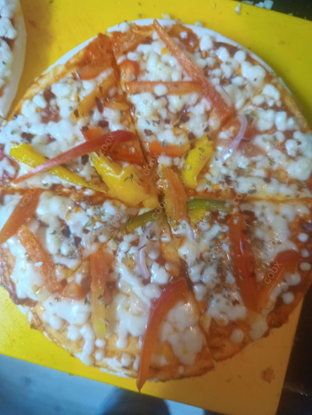 Delicious Veg Pizza prepared by COOX