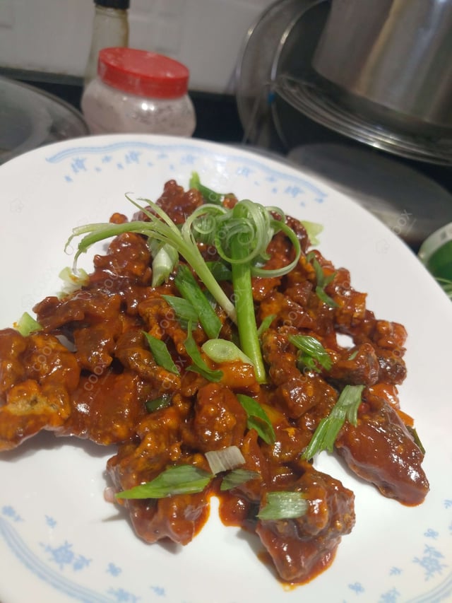 Delicious Crispy Chilli Lamb prepared by COOX