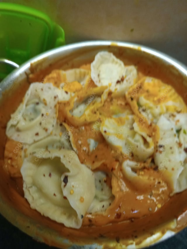 Delicious Ravioli in Pink Sauce prepared by COOX