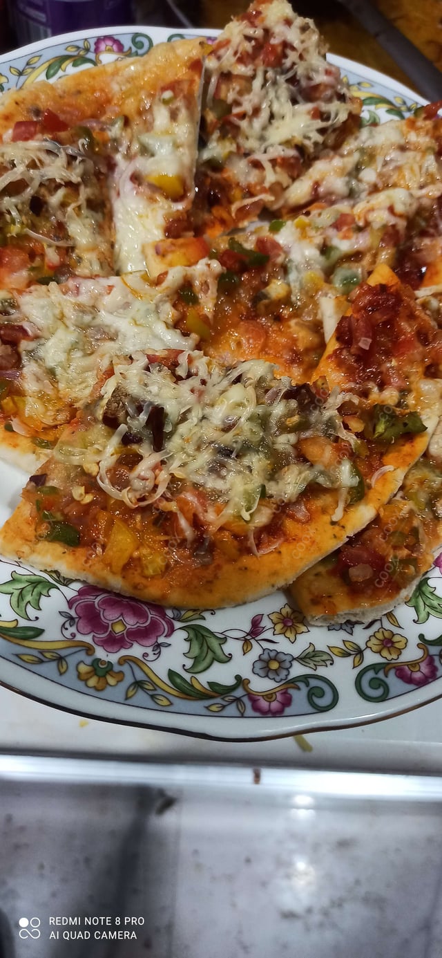 Delicious Veg Pizza prepared by COOX