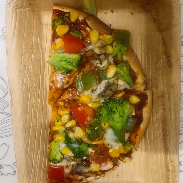 Delicious Veg Pizza prepared by COOX