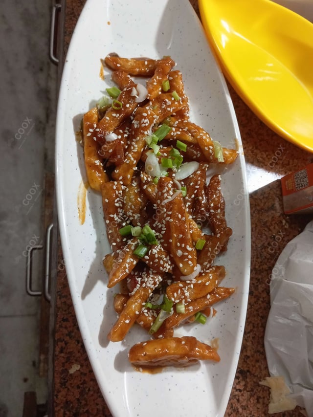 Delicious Honey Chilli Potato prepared by COOX