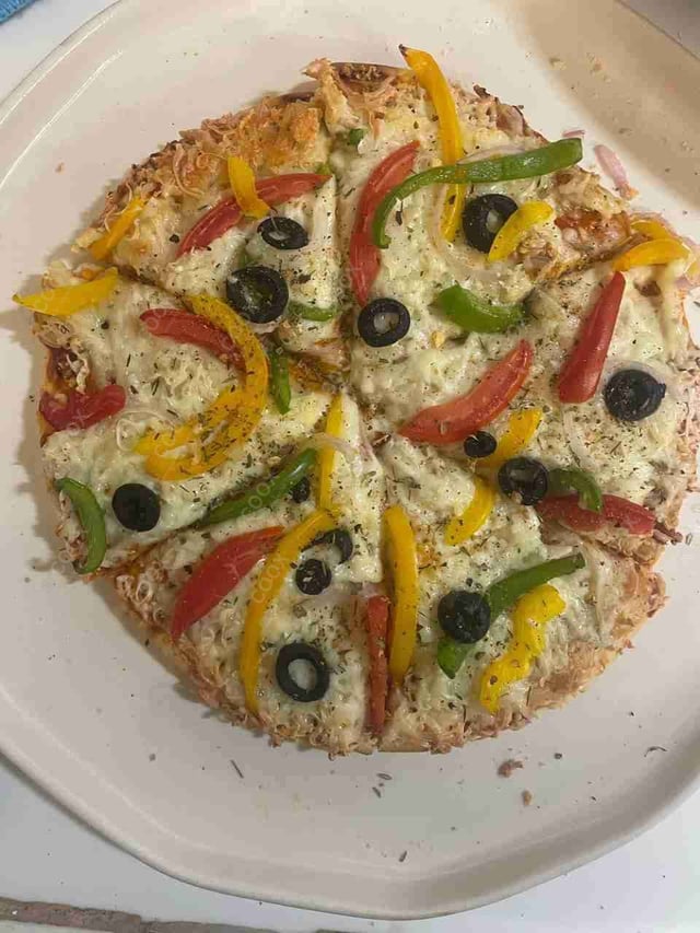 Delicious Veg Pizza prepared by COOX