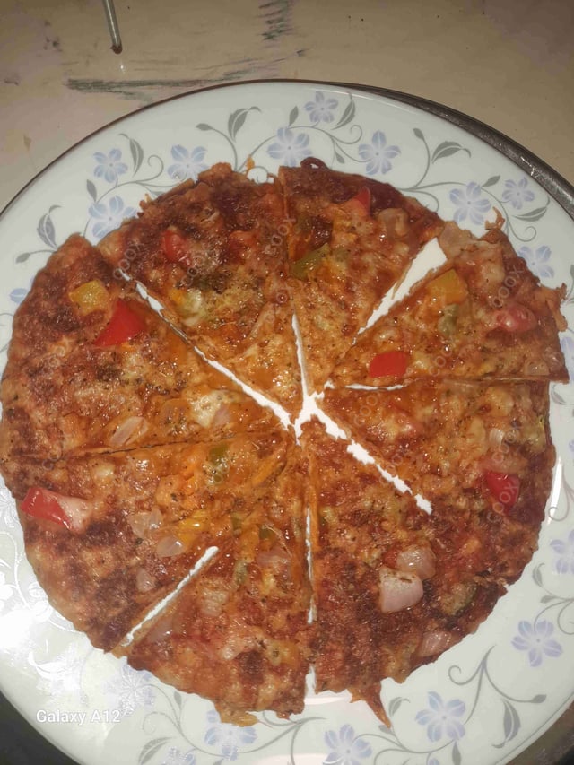 Delicious Veg Pizza prepared by COOX