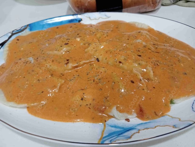 Delicious Ravioli in Pink Sauce prepared by COOX