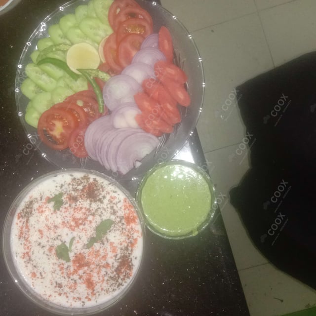 Delicious Salad, Raita, Papad prepared by COOX