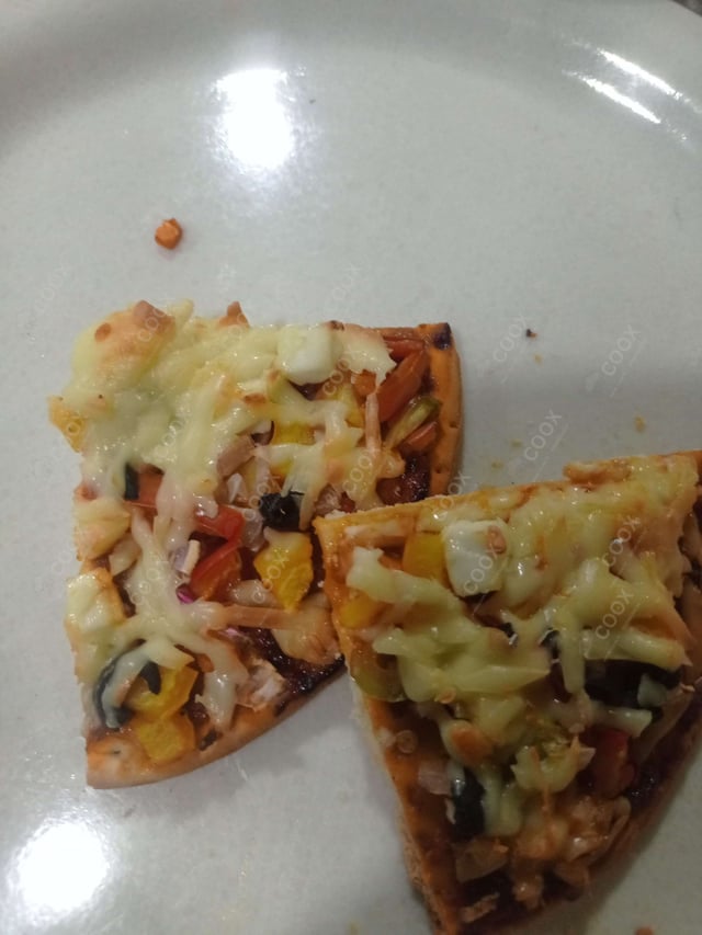 Delicious Veg Pizza prepared by COOX