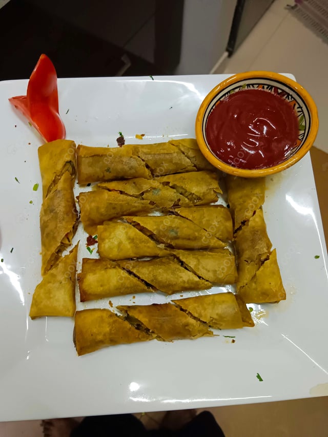 Delicious Veg Spring Rolls prepared by COOX