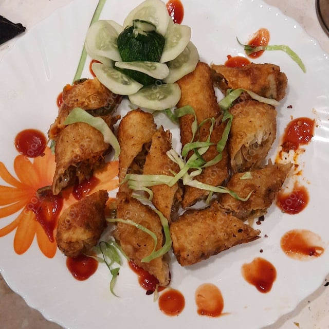 Delicious Veg Spring Rolls prepared by COOX