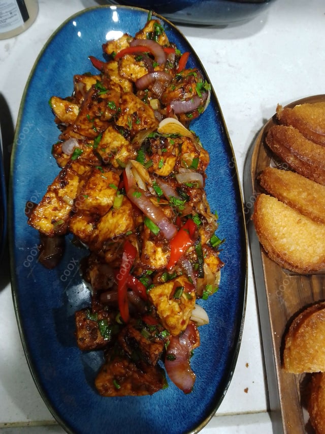 Delicious Chilli Paneer (Dry) prepared by COOX