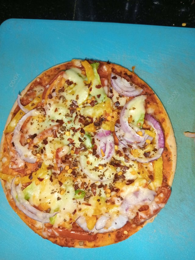 Delicious Veg Pizza prepared by COOX