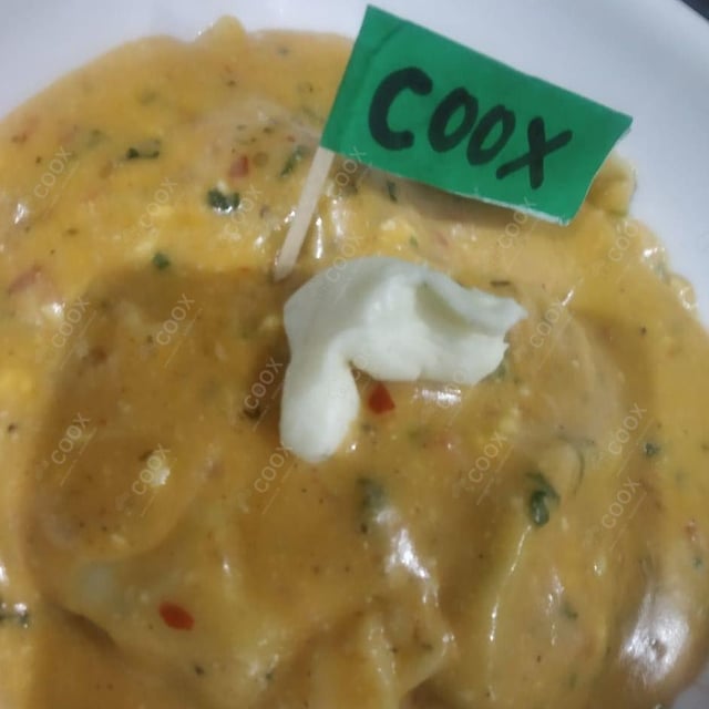 Delicious Ravioli in Pink Sauce prepared by COOX