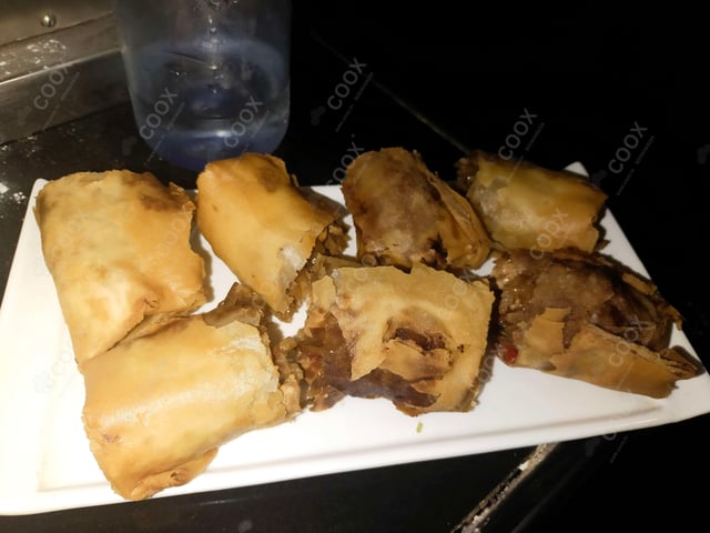 Delicious Chicken Spring Rolls prepared by COOX