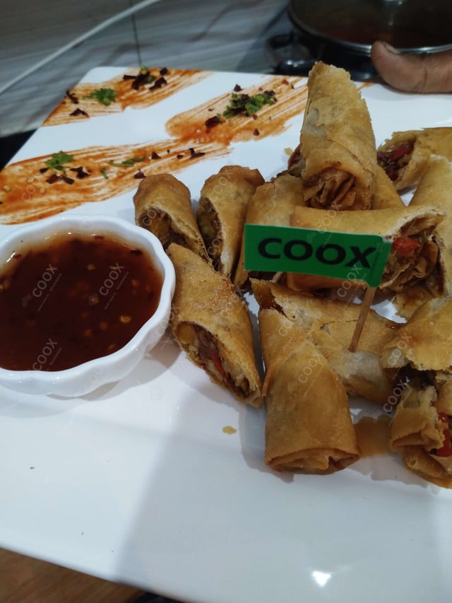 Delicious Veg Spring Rolls prepared by COOX