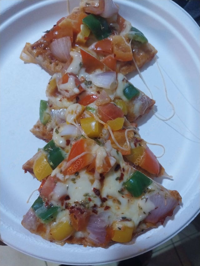 Delicious Veg Pizza prepared by COOX