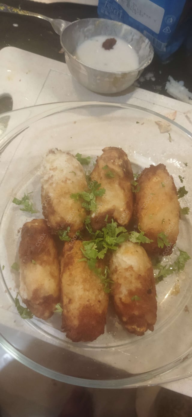 Delicious Dahi ke Sholey prepared by COOX