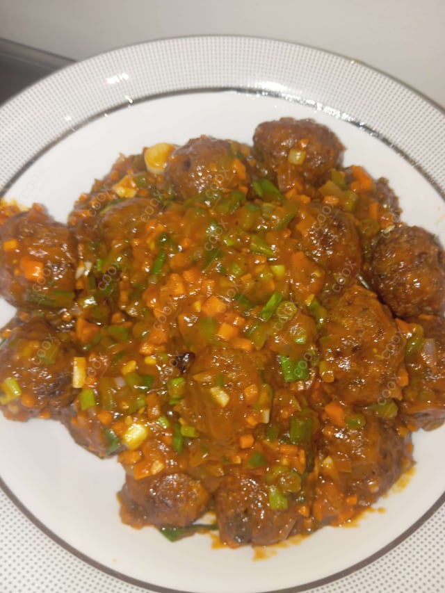 Delicious Veg Manchurian (Dry) prepared by COOX