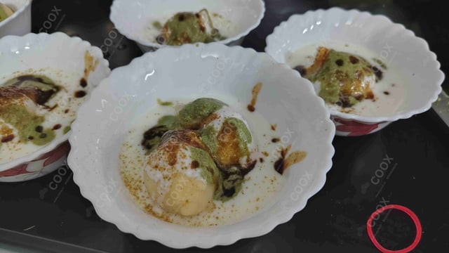 Delicious Dahi Bhalla prepared by COOX