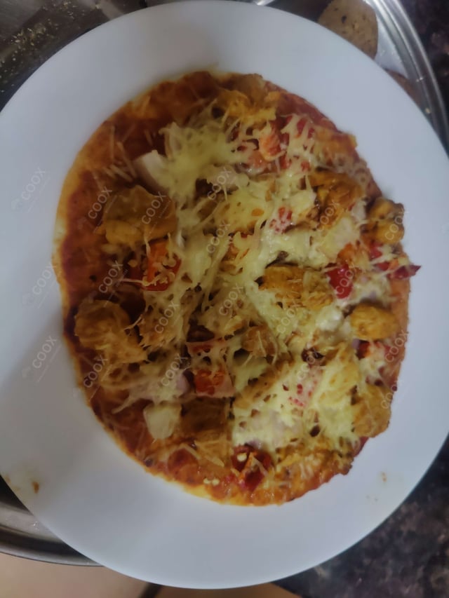 Delicious Chicken Pizza prepared by COOX