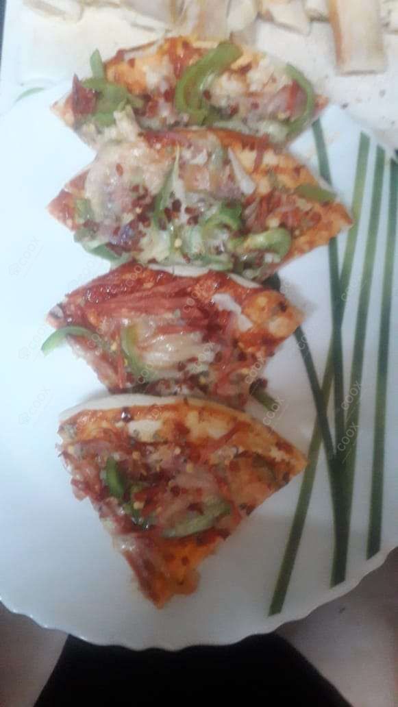 Delicious Veg Pizza prepared by COOX