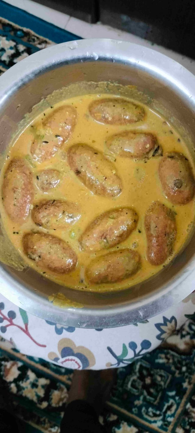 Delicious Malai Kofta (Orange Gravy) prepared by COOX