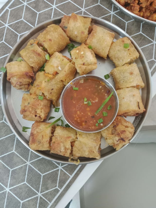 Delicious Veg Spring Rolls prepared by COOX