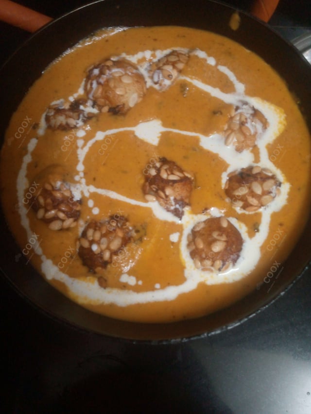 Delicious Malai Kofta (Orange Gravy) prepared by COOX