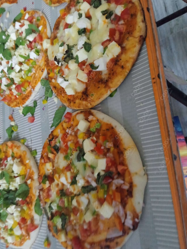 Delicious Veg Pizza prepared by COOX