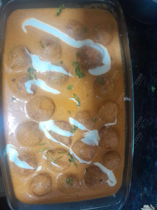 Delicious Malai Kofta (Orange Gravy) prepared by COOX