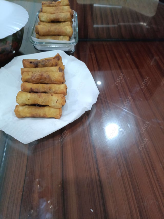 Delicious Chicken Spring Rolls prepared by COOX